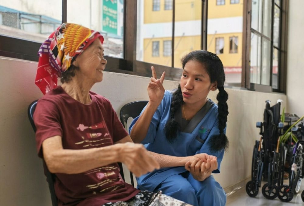 Gentle Hill caregiver supporting elderly resident with warm daily care